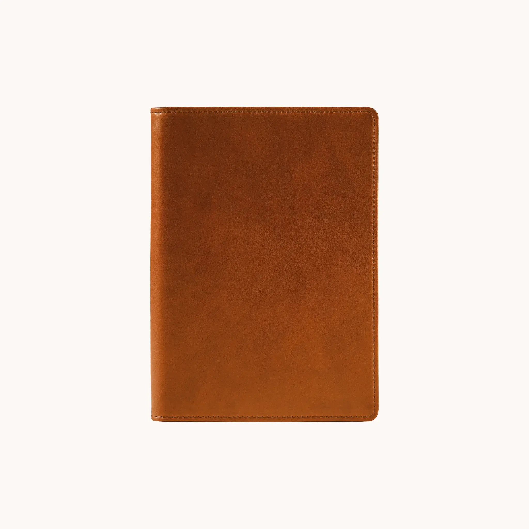 Lunburg Memoir Notebook Cover in Heritage Amber, front view closed, showing the clean face of vegetable-tanned Perpetual Leather (from Tempesti) with folded edge construction and no visible raw edges.