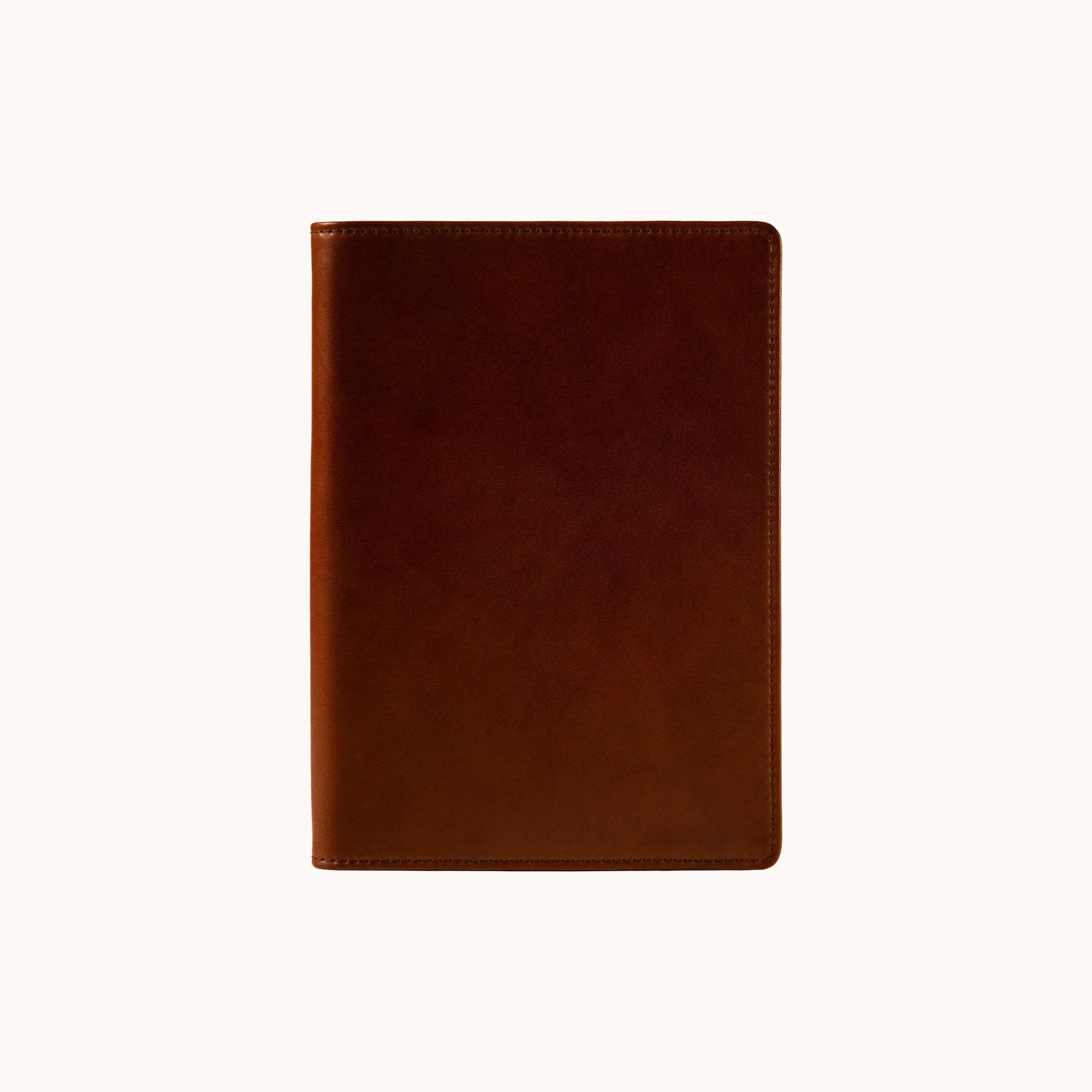 Lunburg Memoir Notebook Cover in Deep Mahogany, front view closed, showing the clean face of vegetable-tanned Perpetual Leather (from Tempesti) with folded edge construction and no visible raw edges.