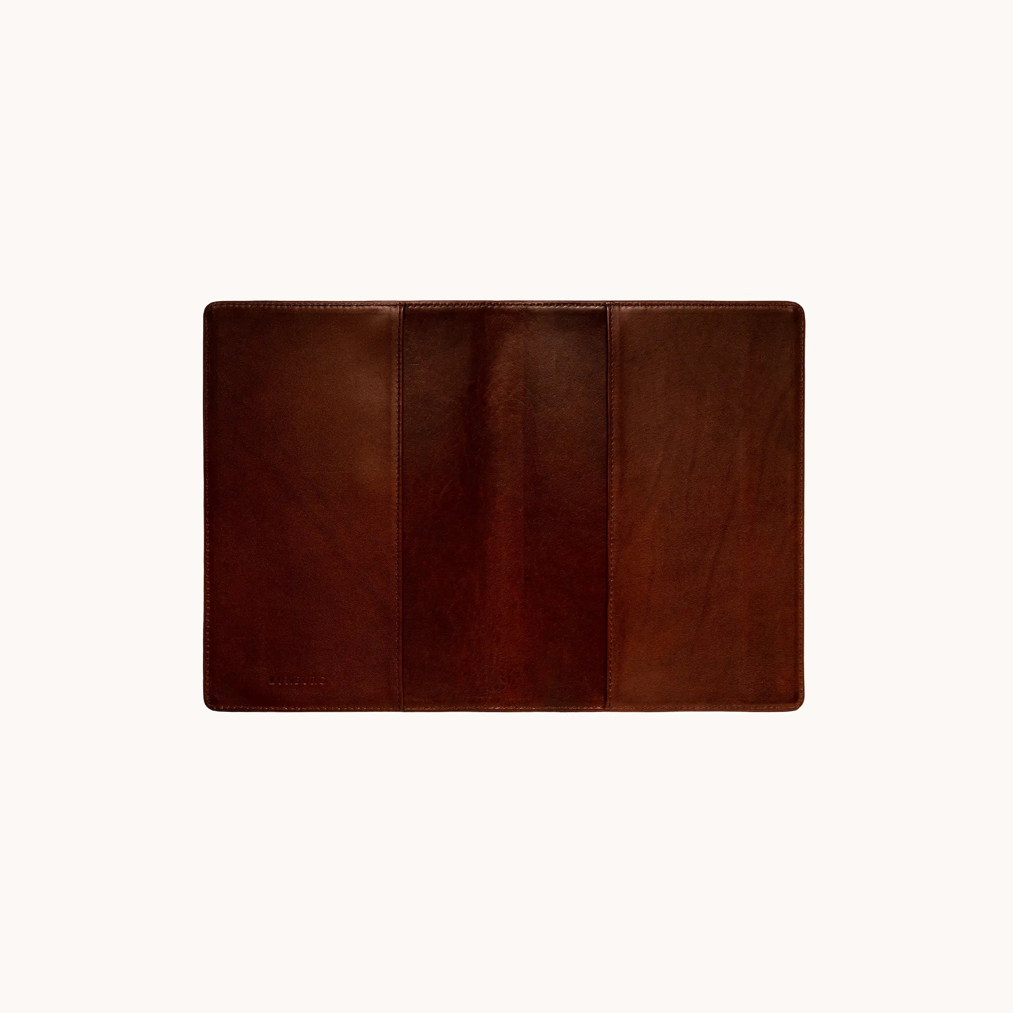 Lunburg Memoir Notebook Cover in Deep Mahogany, fully open interior view showing the left and right tuck sleeves with the heat-embossed Lunburg mark on the lower left, in vegetable-tanned Perpetual Leather (from Tempesti) with folded edge construction throughout.
