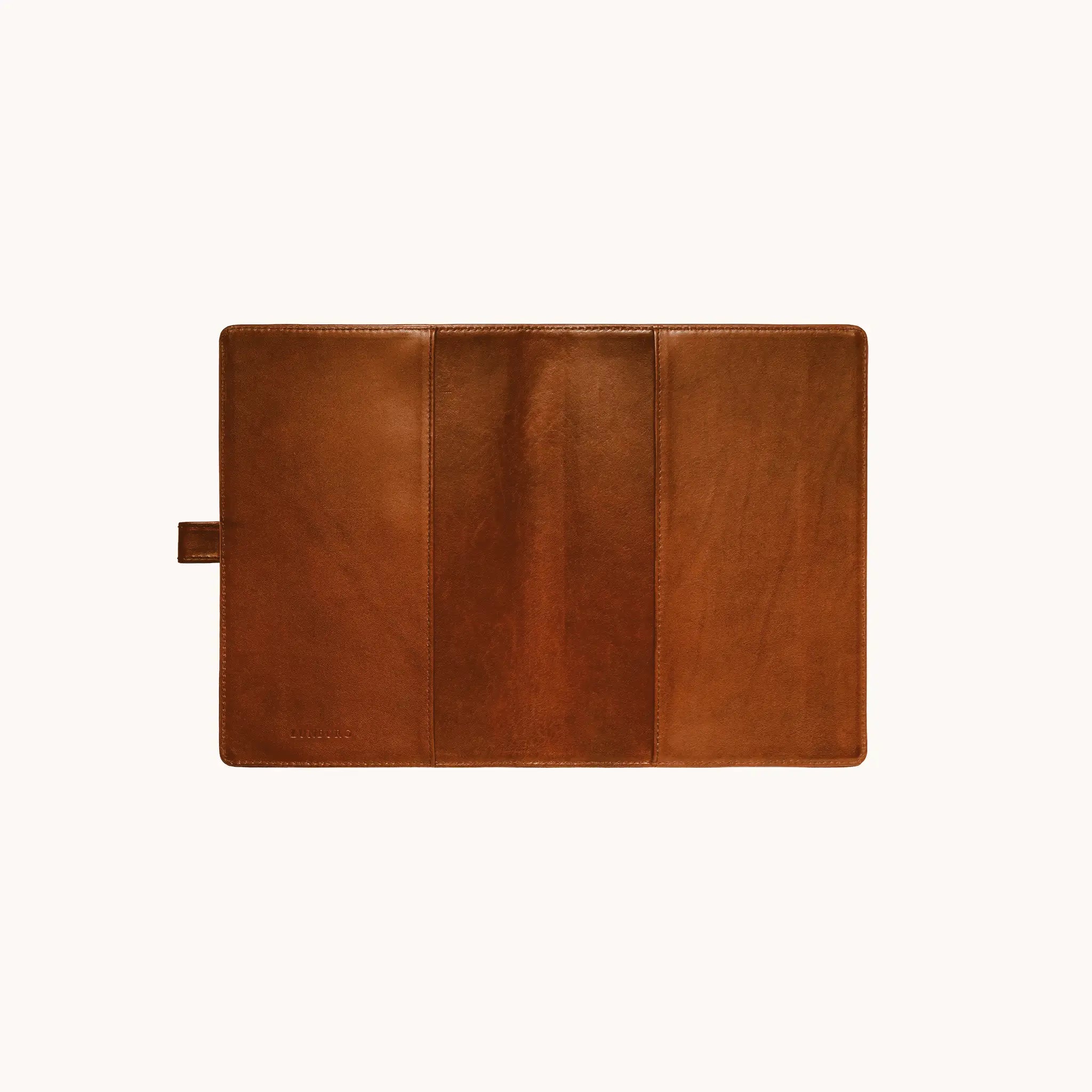 Lunburg Memoir Notebook Cover with Pen Loop in Heritage Amber, fully open interior view showing the left and right tuck sleeves, the leather pen loop on the left edge, and the heat-embossed Lunburg mark on the lower left, in vegetable-tanned Perpetual Leather (from Tempesti) with folded edge construction throughout.