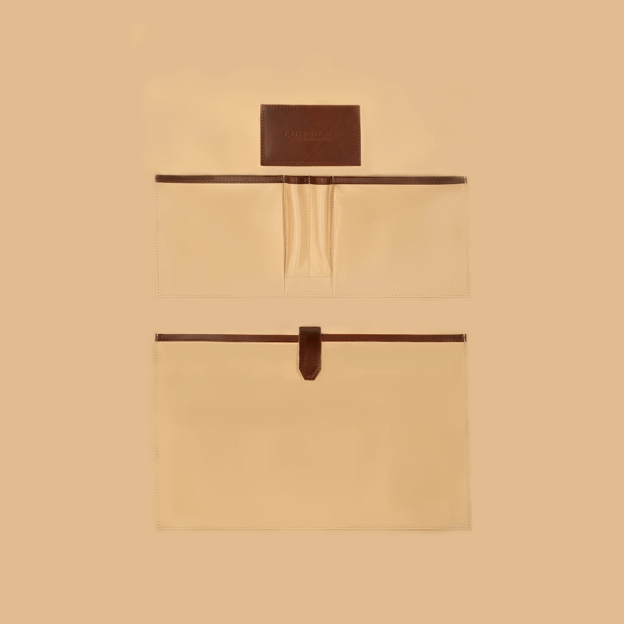 Lunburg Opus Briefcase Essential interior vertical layout in Deep Mahogany, high-contrast goat leather lining with heat-embossed Lunburg card holder, two pen holders, one large laptop compartment, and two large open pockets for documents and accessories, with Deep Mahogany Perpetual Leather (from Tempesti) trim and leather strap closure.