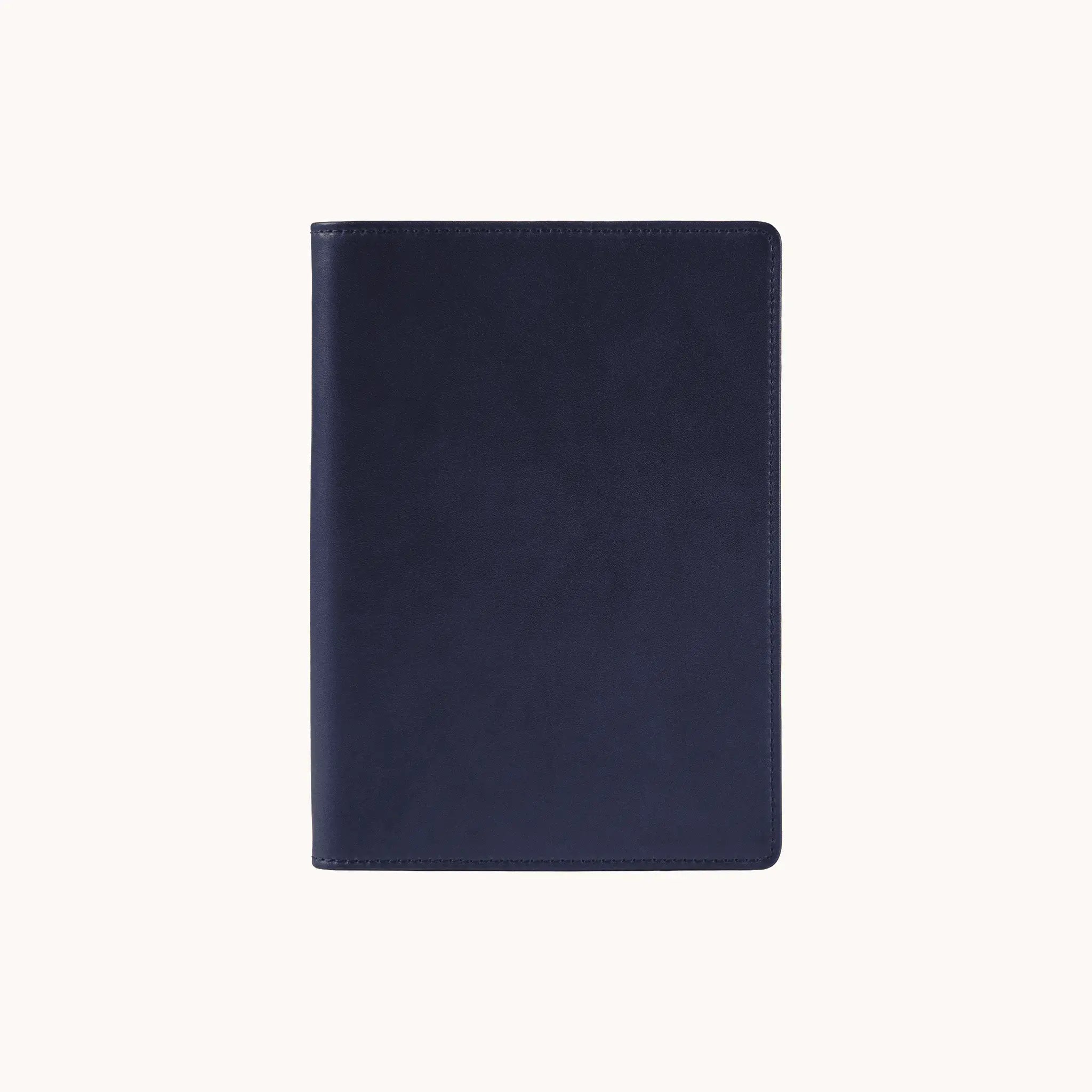 Lunburg Memoir Pocket Notebook Cover in Nocturnal Sapphire, front view closed, showing the clean face of vegetable-tanned Perpetual Leather (from Tempesti) with folded edge construction.