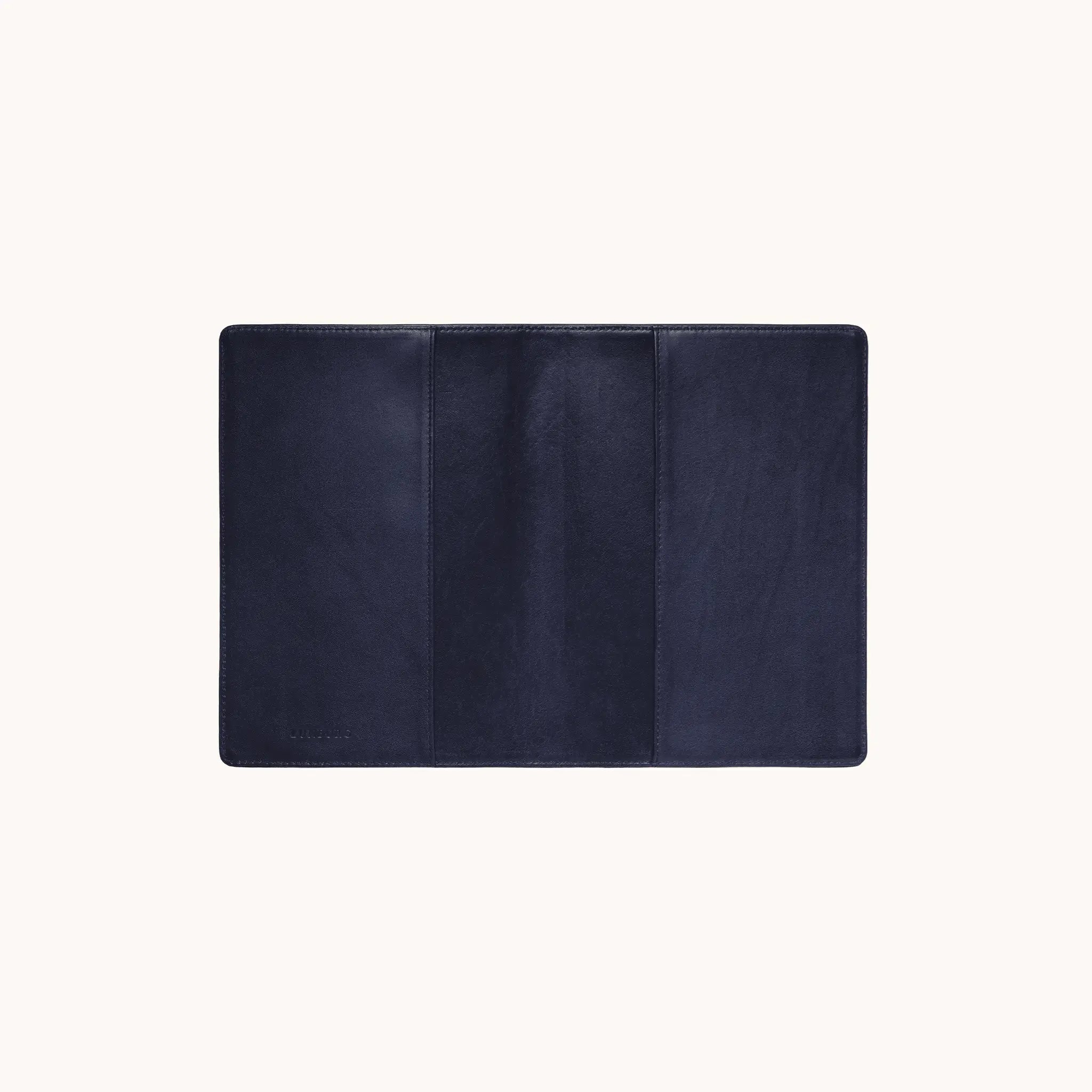 Lunburg Memoir Pocket Notebook Cover in Nocturnal Sapphire, fully open interior view showing the left and right tuck sleeves and the heat-embossed Lunburg mark on the lower left, in vegetable-tanned Perpetual Leather (from Tempesti) with folded edge construction throughout.