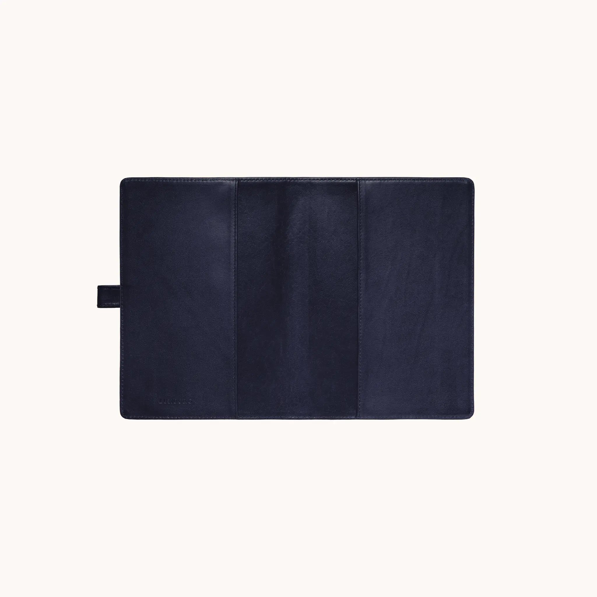 Lunburg Memoir Pocket Notebook Cover with Pen Loop in Nocturnal Sapphire, fully open interior view showing the left and right tuck sleeves, the leather pen loop on the left edge, and the heat-embossed Lunburg mark on the lower left, in vegetable-tanned Perpetual Leather (from Tempesti) with folded edge construction throughout.