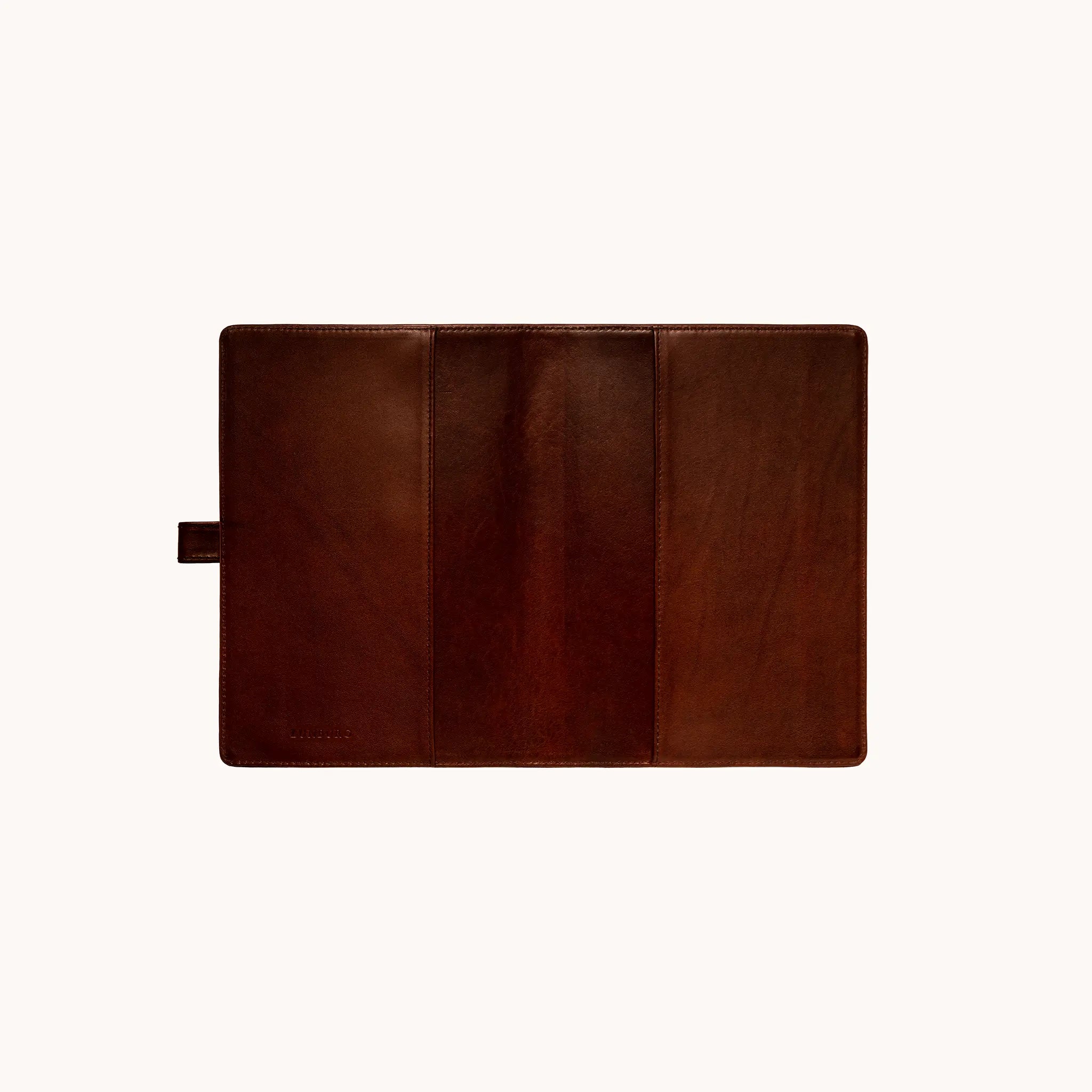 Lunburg Memoir Pocket Notebook Cover with Pen Loop in Deep Mahogany, fully open interior view showing the left and right tuck sleeves, the leather pen loop on the left edge, and the heat-embossed Lunburg mark on the lower left, in vegetable-tanned Perpetual Leather (from Tempesti) with folded edge construction throughout.