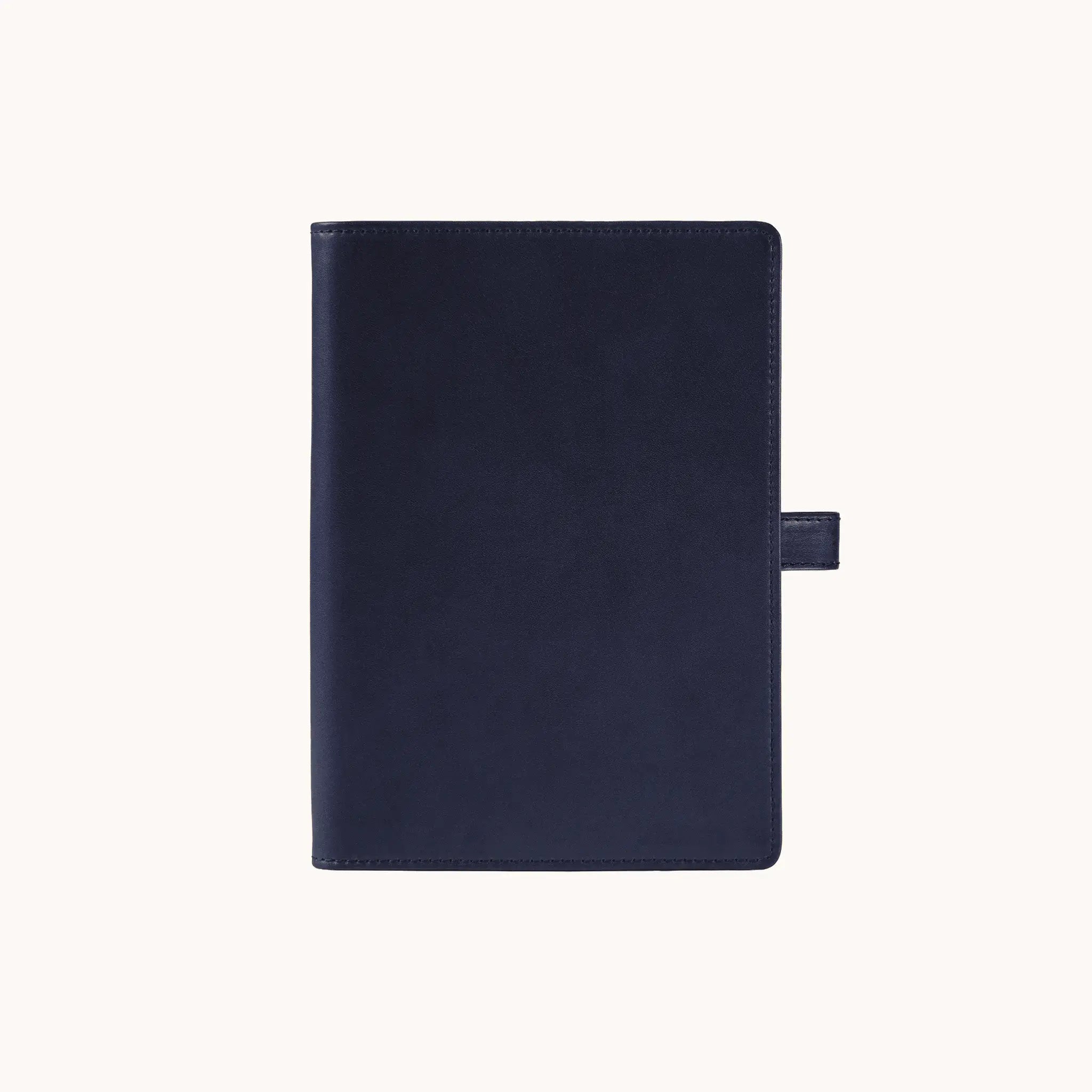 Lunburg Memoir Pocket Notebook Cover with Pen Loop in Nocturnal Sapphire, front view closed, showing the clean face and leather pen loop on the right edge, in vegetable-tanned Perpetual Leather (from Tempesti) with folded edge construction.