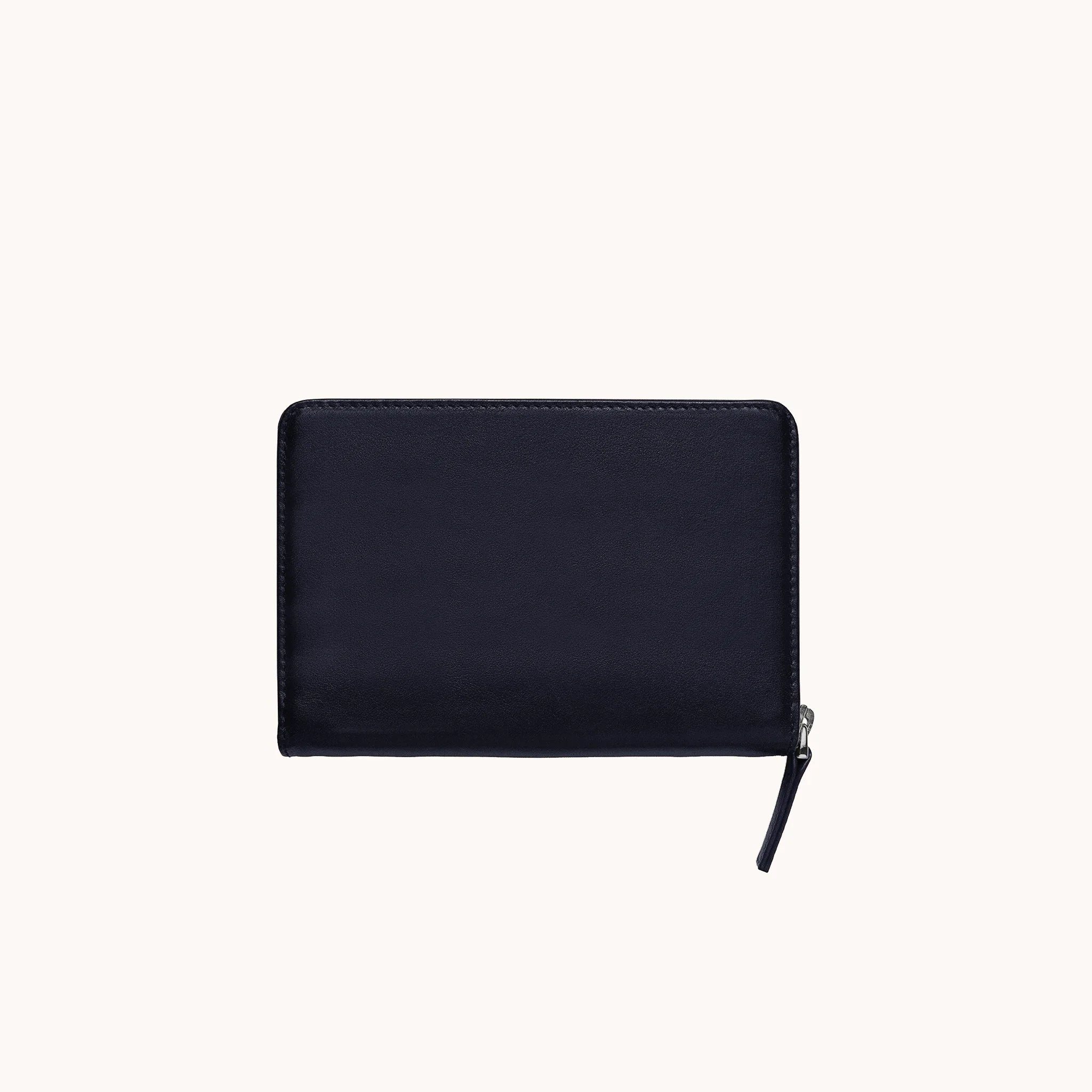 Lunburg Quad Pen Case Curator in Nocturnal Sapphire, front view of closed case in vegetable-tanned Perpetual Leather (from Tempesti), YKK Excella zipper pull resting at lower left, folded edge construction visible along all perimeter edges.