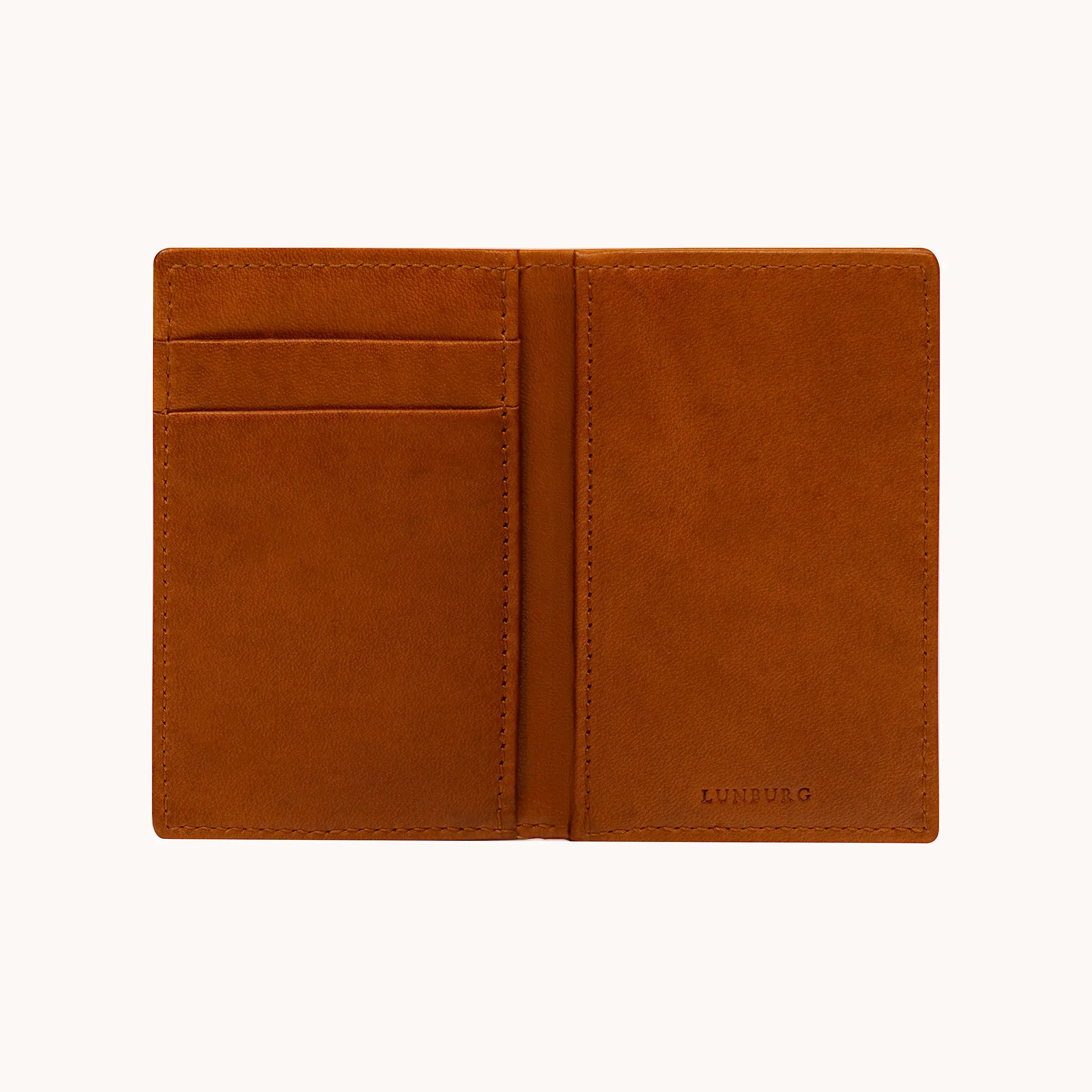 Lunburg Small Vertical Signet Wallet in Heritage Amber fully opened, displaying card slots across both panels, folded edge construction, and heat-embossed Lunburg mark on lower right, in vegetable-tanned Perpetual Leather.
