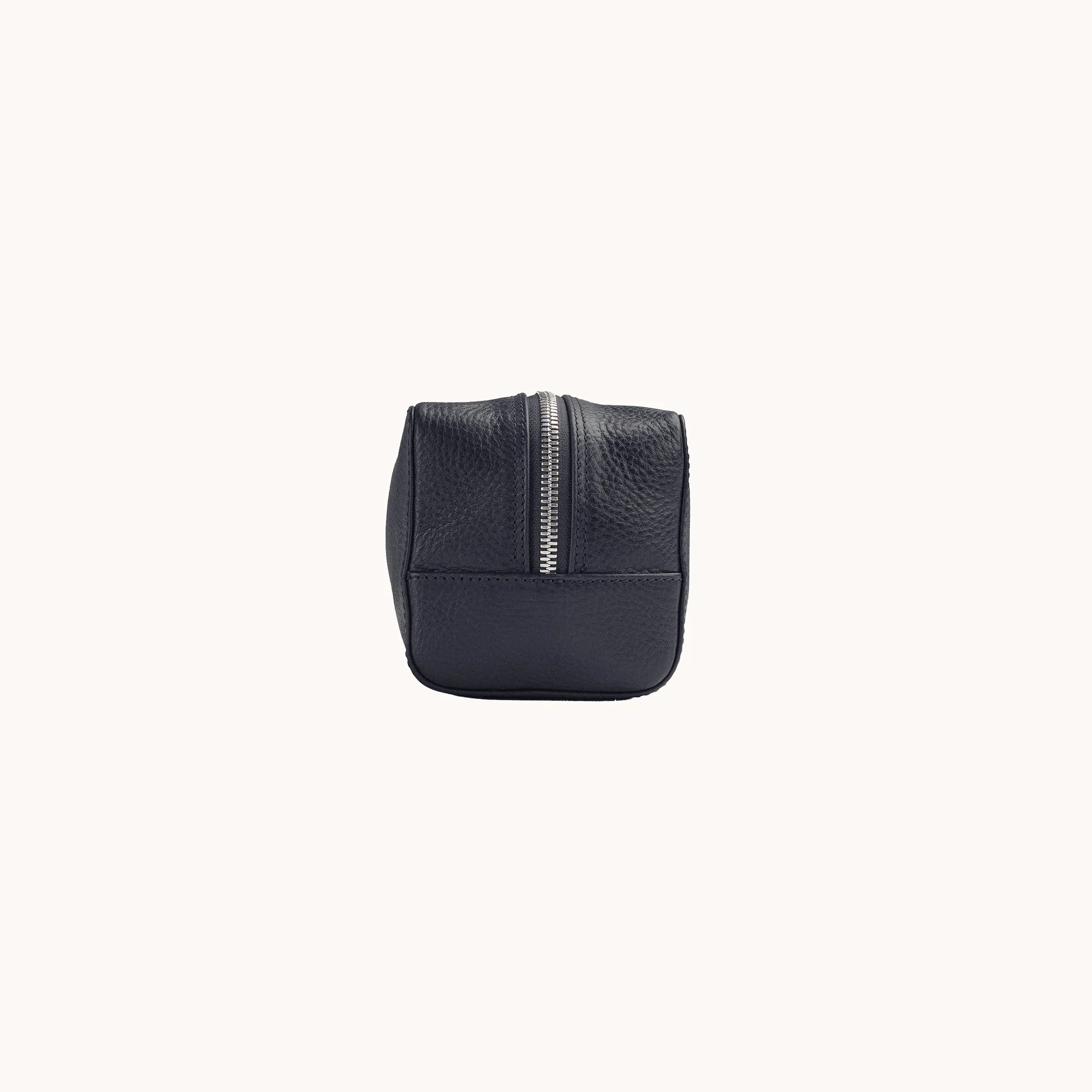 Lunburg Chamberlain Toiletry Bag in tumbled Nocturnal Sapphire leather, opposite side profile with seam and base.